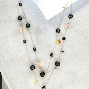 Betsey Johnson Black and Gold Necklace with Pink Accents & charms